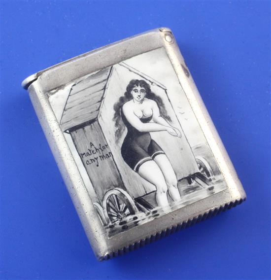 An Edwardian silver and enamel rectangular vesta case decorated with a semi-nude bathing beauty by George Unite, 1.5in.